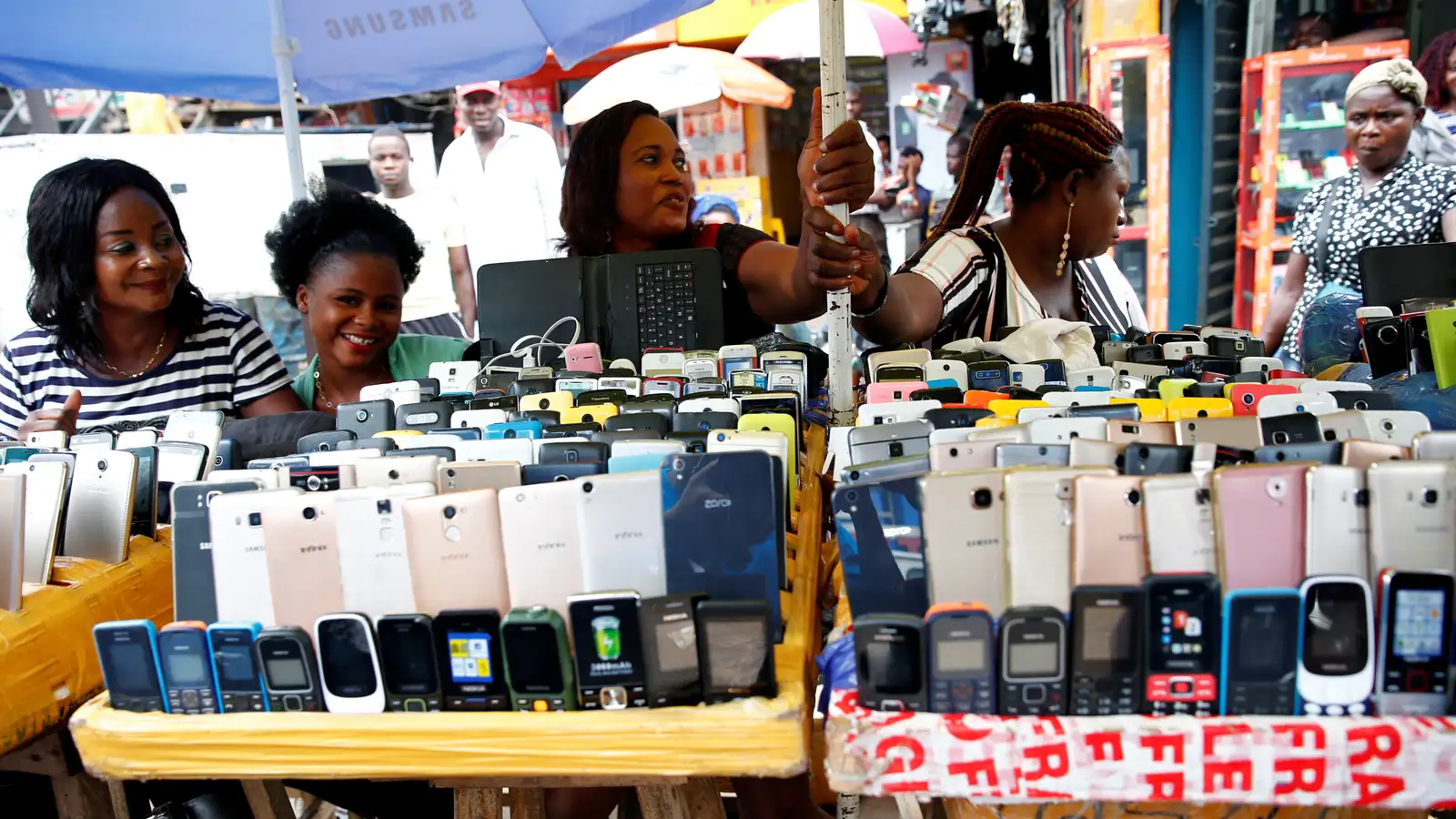 People Buying Phones At A Stand In Africa