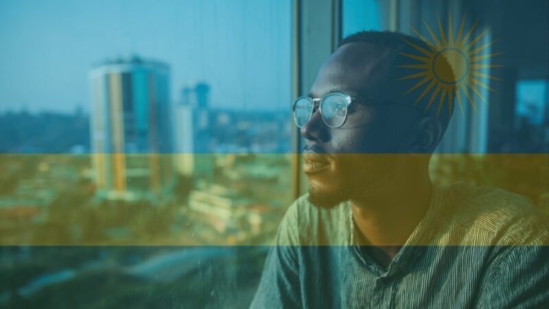 Freelancer in Kigali coworking space with city skyline