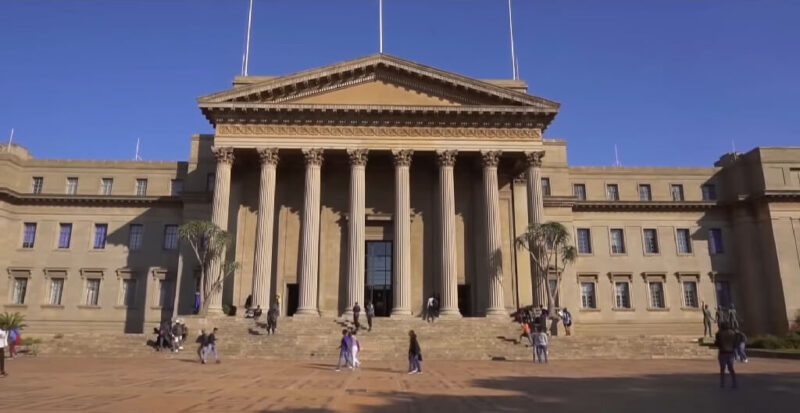 Historic Great Hall at the University of the Witwatersrand with students gathered on the plaza