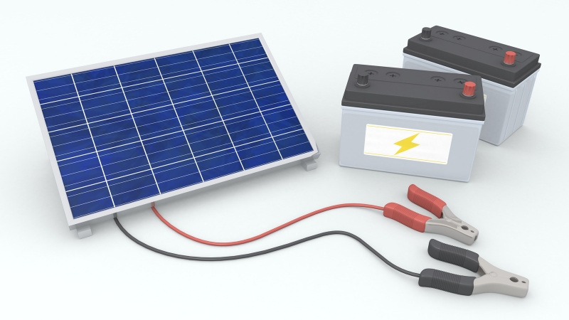 Solar panel connected to storage batteries illustrating LiFePO4 vs. Lead Acid maintenance and usage setup