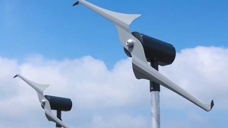 Two small wind turbines mounted on poles