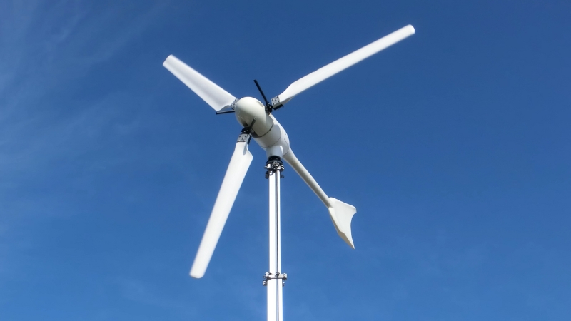 Small three-blade wind turbine mounted on a pole